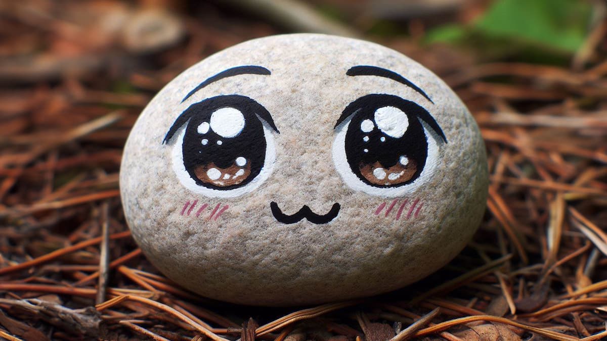 Stein bemalt mit Mangagesicht durch edding Acrylmarker