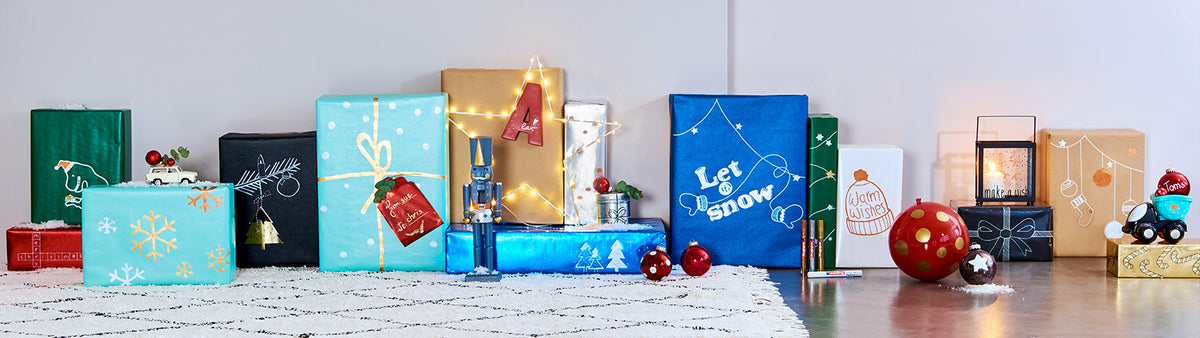 Geschenkpapier verschönert mit Glanzlackmarkern